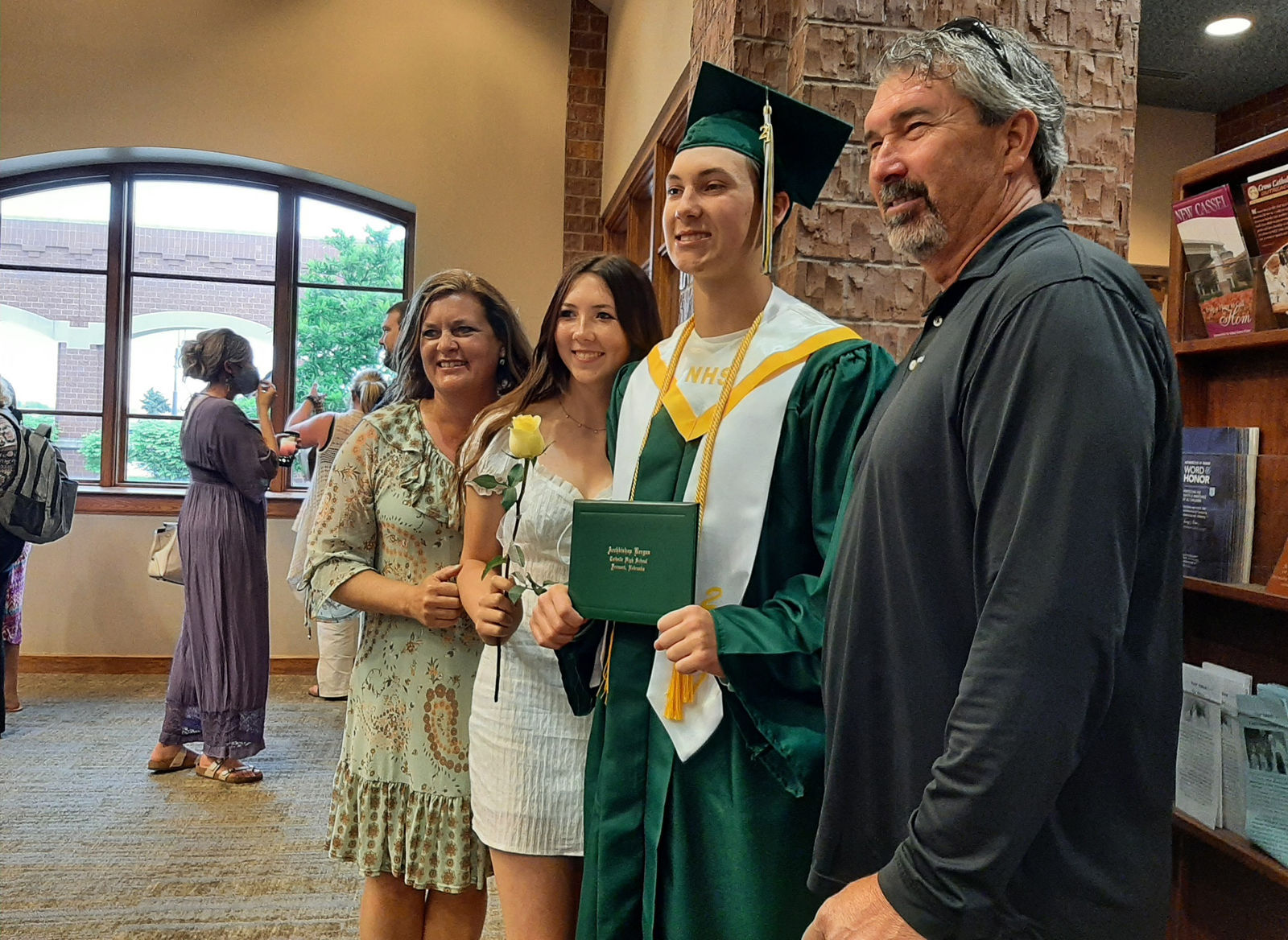 Family and graduate pose for photo